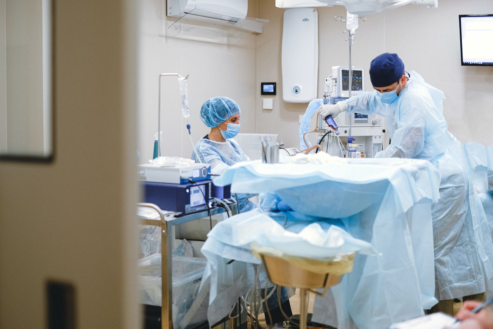 Single Port Robotic Surgery - surgical team in an operating room during robotic prostatectomy