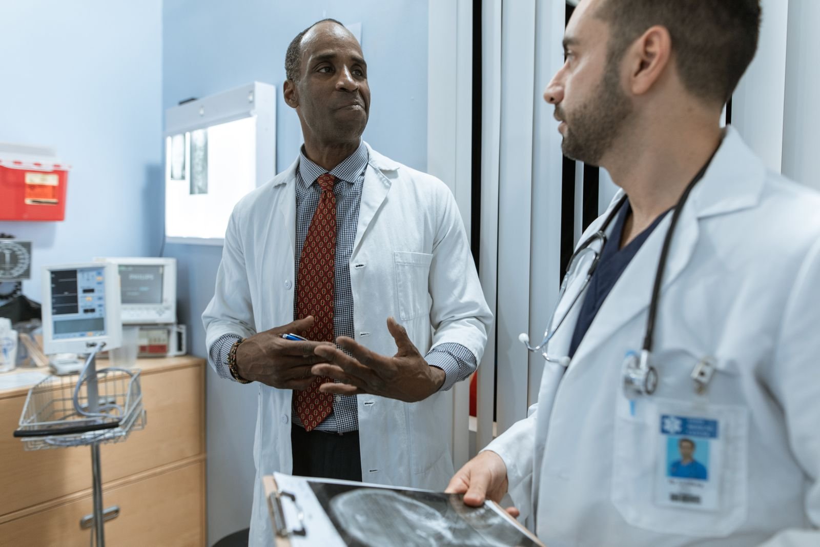 Single Port Robotic Surgery - two doctors discussing a treatment plan and imaging