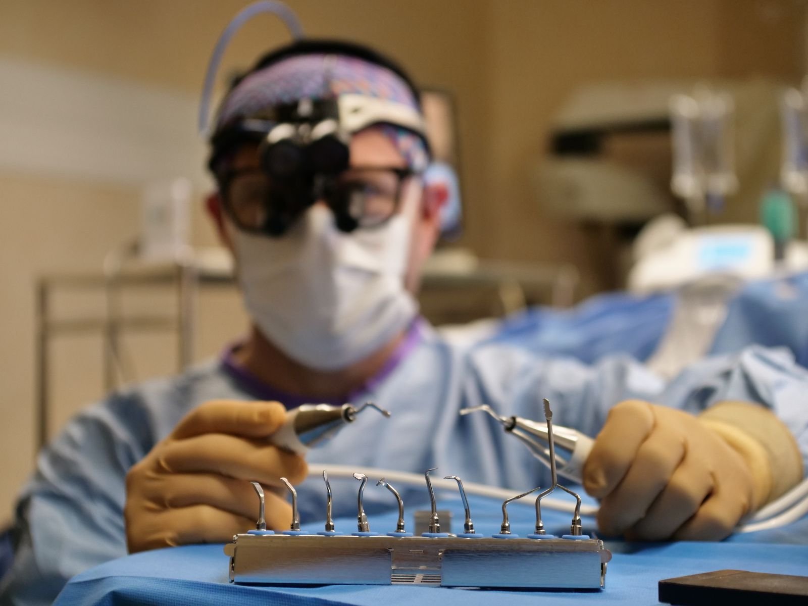Single Port Robotic Surgery - surgeon preparing fine surgical instruments