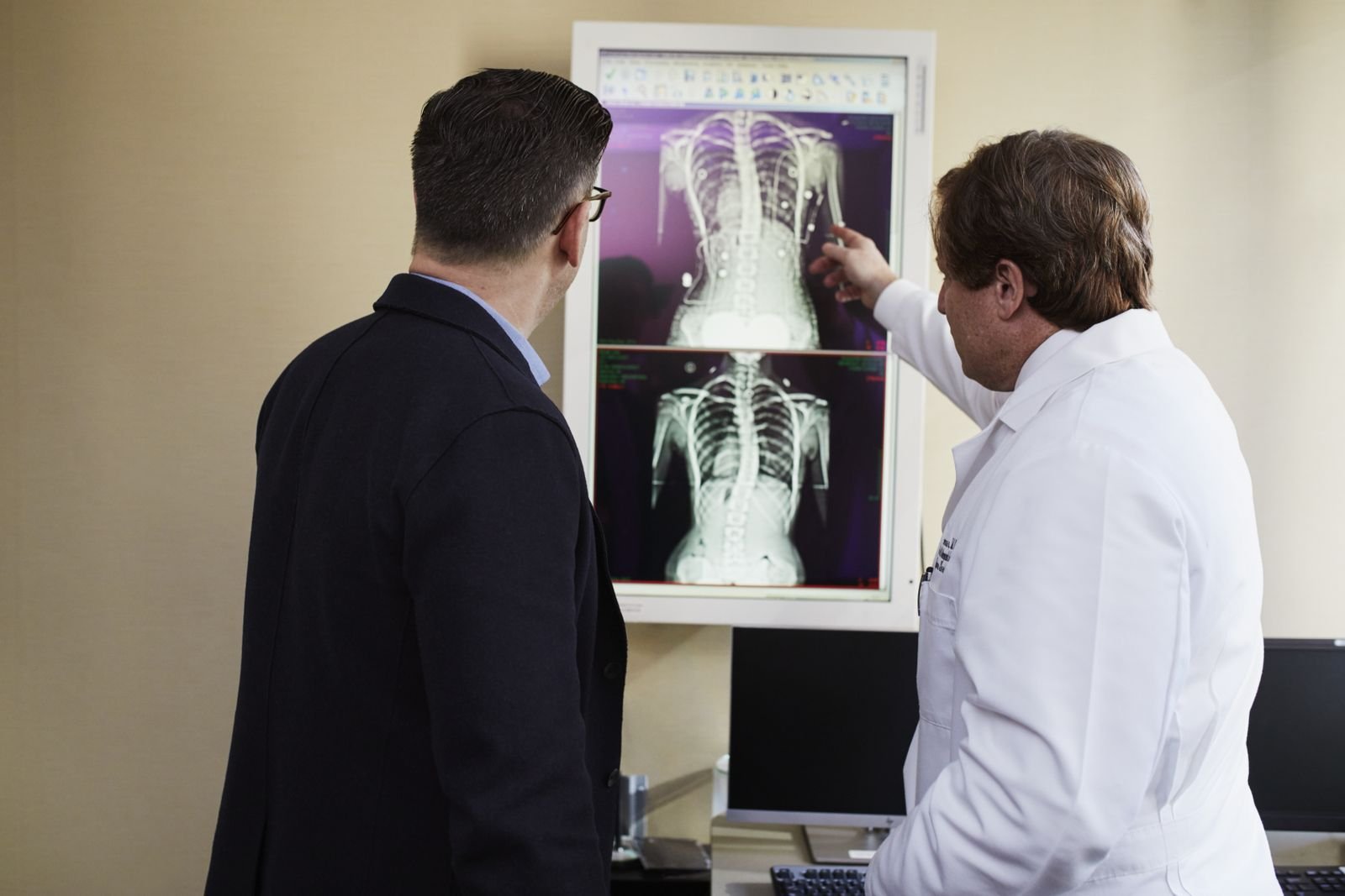 Single Port Robotic Surgery - doctor explaining anatomy on imaging to a male patient
