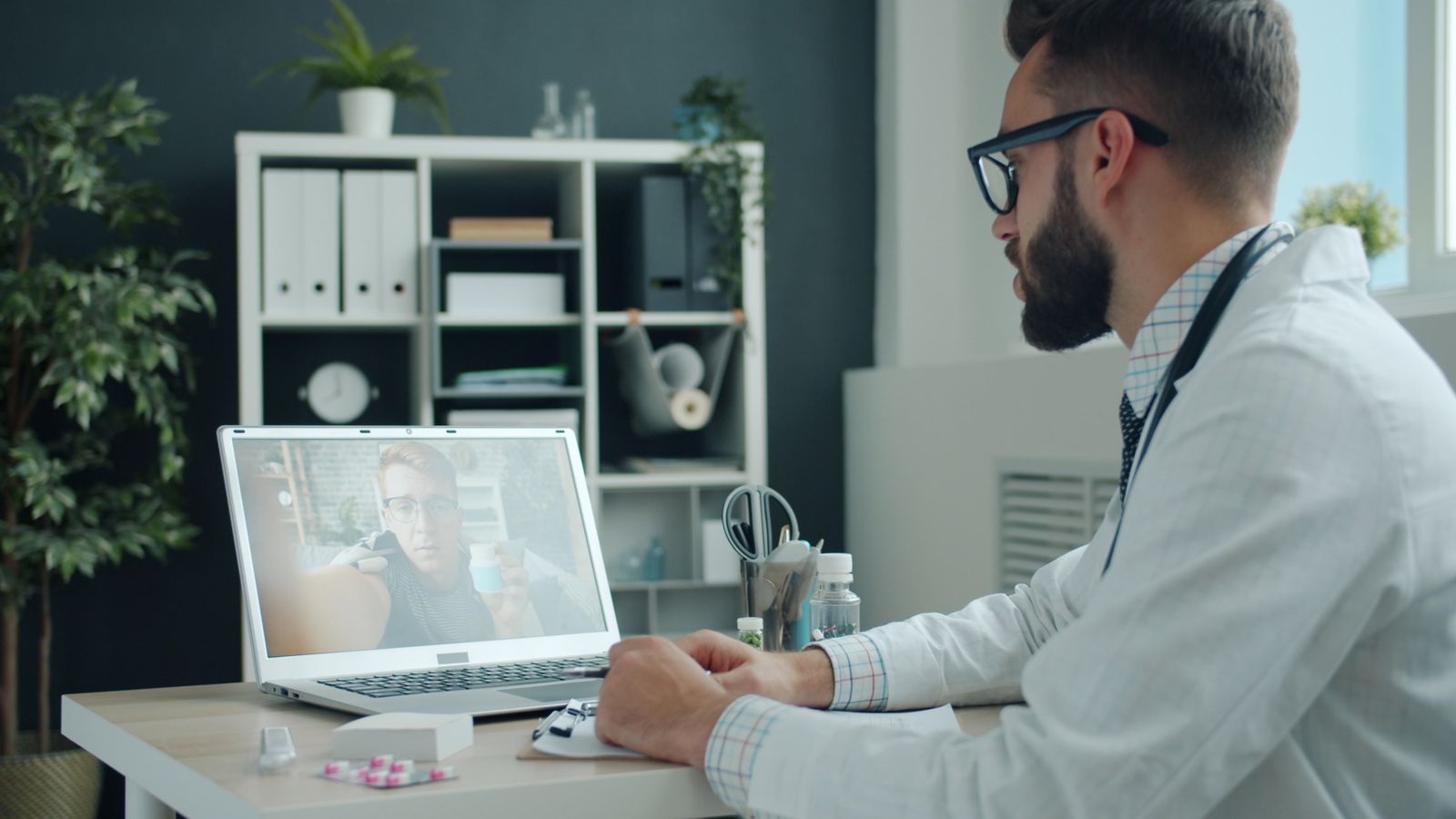 Single Port Robotic Surgery - urologist holding a video consultation on a laptop